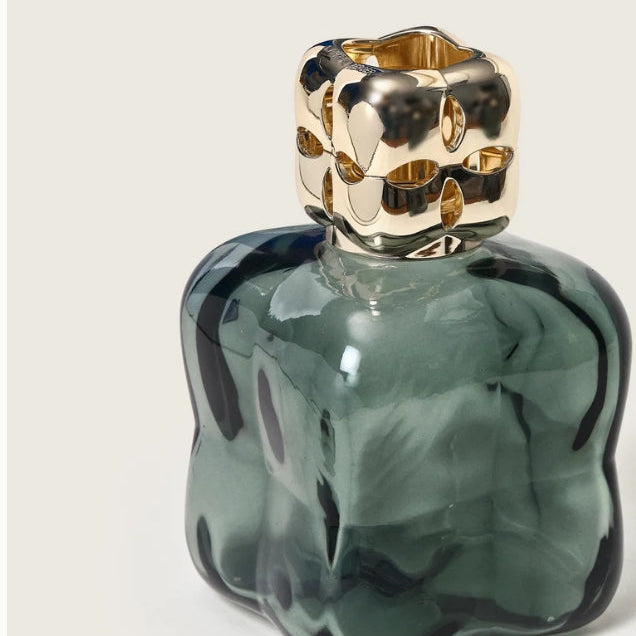 Green home fragrance bottle with gold cap