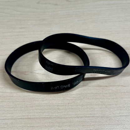 Two vacuum belts sitting on flat surface. These belts fit Riccar SupraLite, Simplicity Freedom, and Titan T500 vacuums.