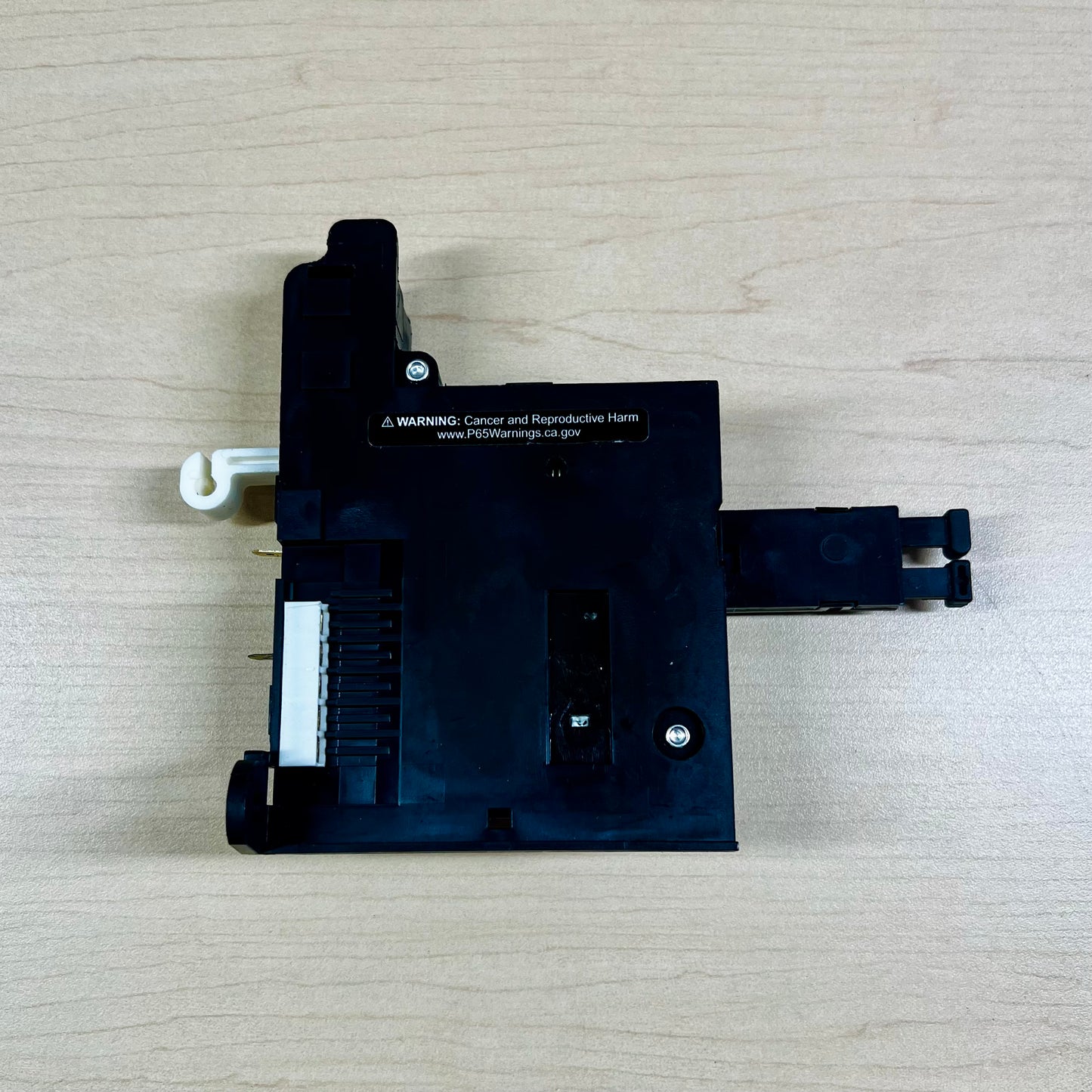 Back side view of the Kirby on/off switch, where the switch connects onto the motor.