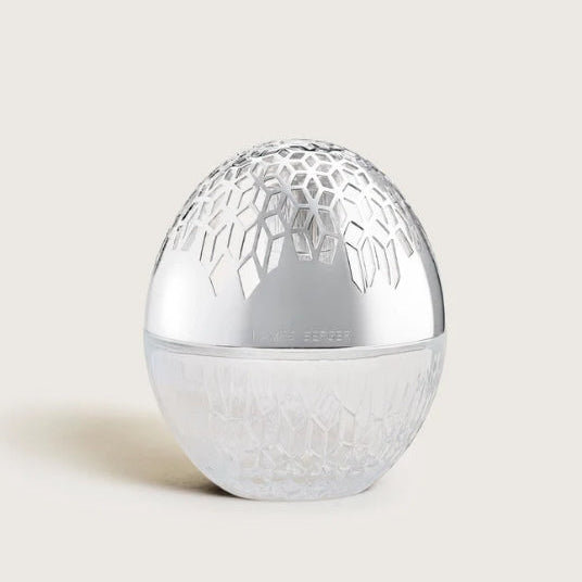 Clear glass lamp with cut in design and a silver diffusion top made by Maison Berger Paris.
