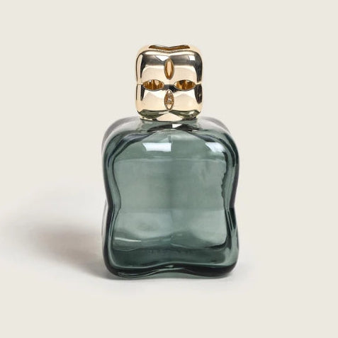 Green glass bottle with gold cap