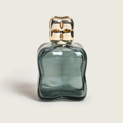 Green glass bottle with gold cap