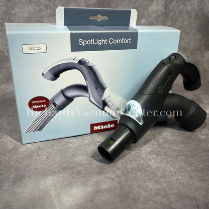 Miele Spotlight Comfort vacuum handle attachment with light on.