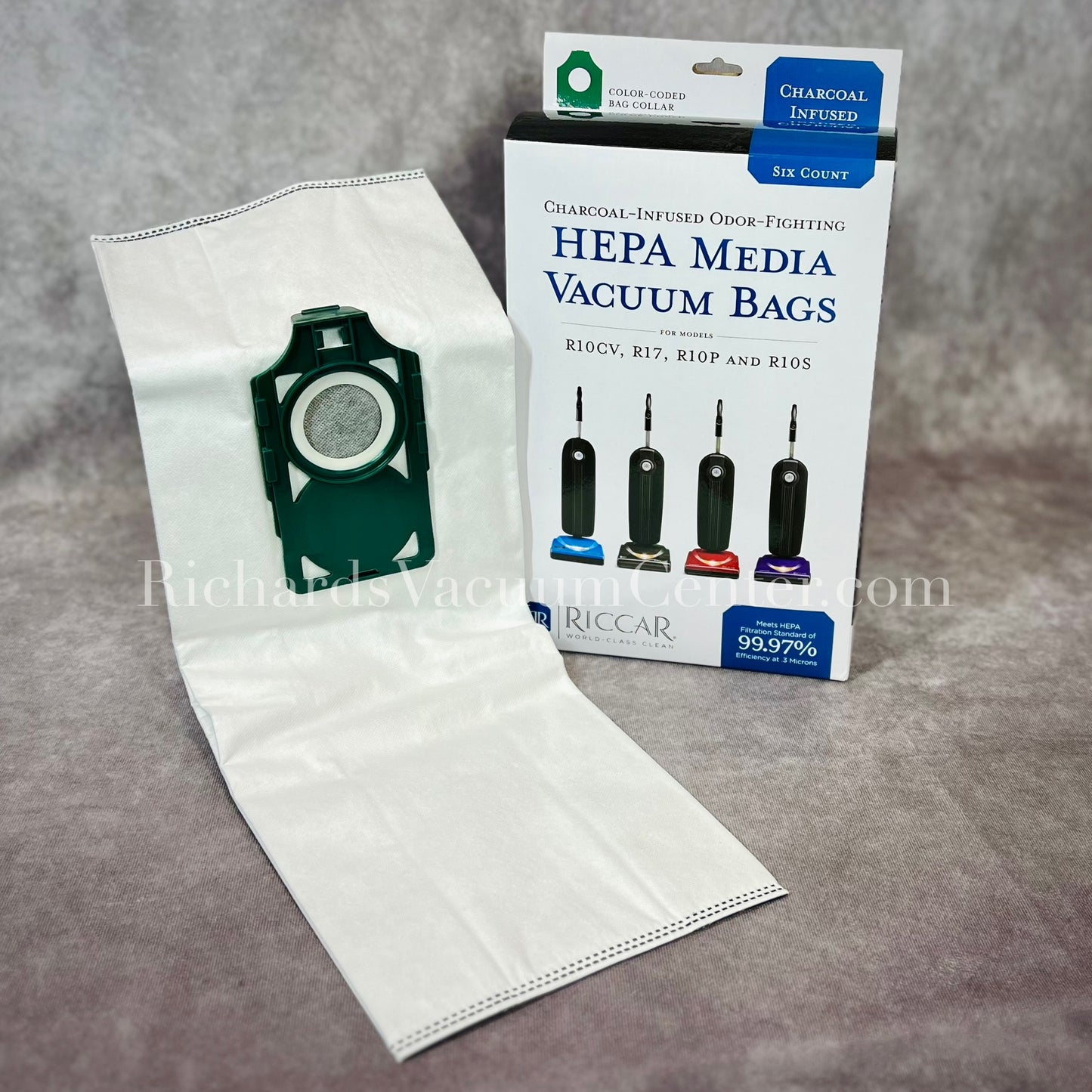 Packaging and one HEPA vacuum bag displayed in front, with a green collar, compatible with Riccar SupraLite Vacuums.