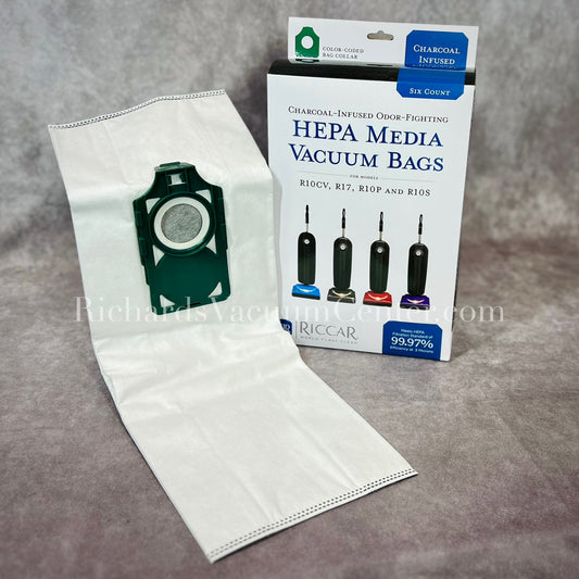 Packaging and one HEPA vacuum bag displayed in front, with a green collar, compatible with Riccar SupraLite Vacuums.
