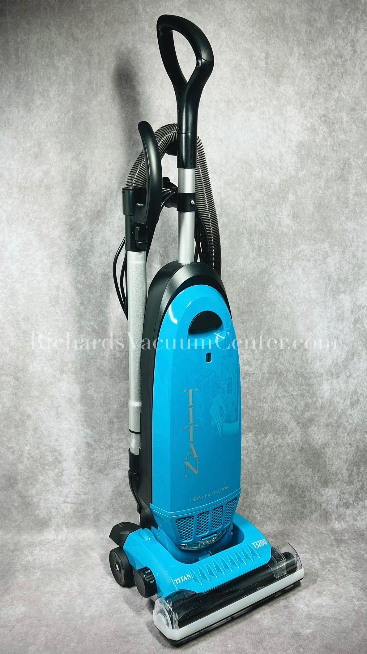 Upright vacuum cleaner featuring a HEPA bag and on-board tools.